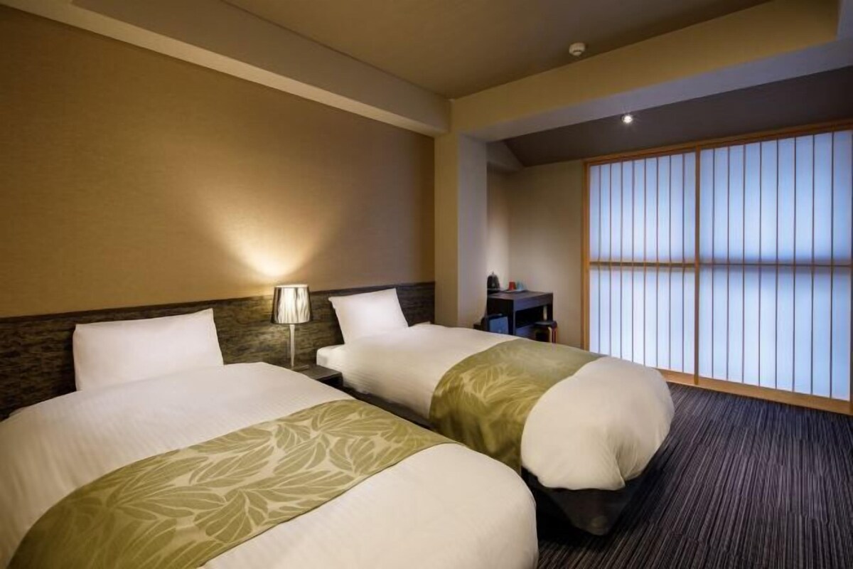 Down duvets, pillow-top beds, desk, blackout curtains