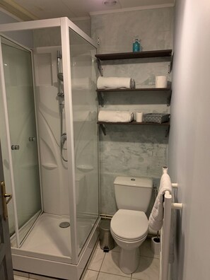 Shower, hair dryer, towels, soap