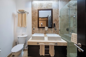 Combined shower/tub, hair dryer, towels, toilet paper