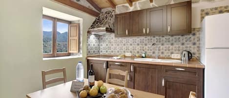 Fridge, microwave, stovetop, coffee/tea maker