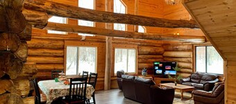 Log home surrounded by woods near Upper South Long Lake