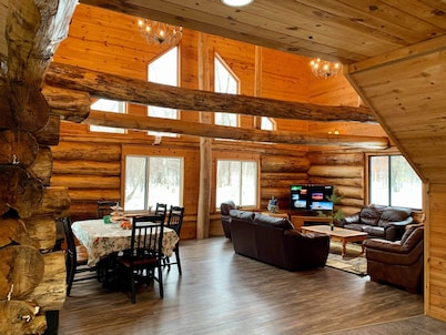 Log home surrounded by woods near Upper South Long Lake
