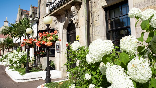 A historic building with a prominent sign reading "Hotel." - The Woodside Hotel, Aberdour. Exclusive Use (Burntisland)