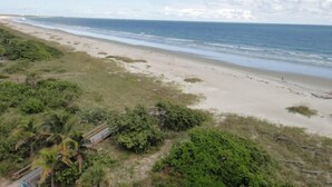 A beach with a clear view of the ocean and a path leading to the shore. - Ocean Front Luxury #801 (Cape Canaveral)
