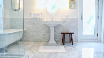 Bathtub, hair dryer, towels, soap