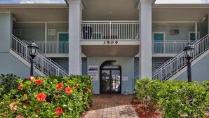 A building with a registration lobby and a number 3509. - Coastal Waters 214, 2nd floor 1 bedroom ocean view condo (New Smyrna Beach)