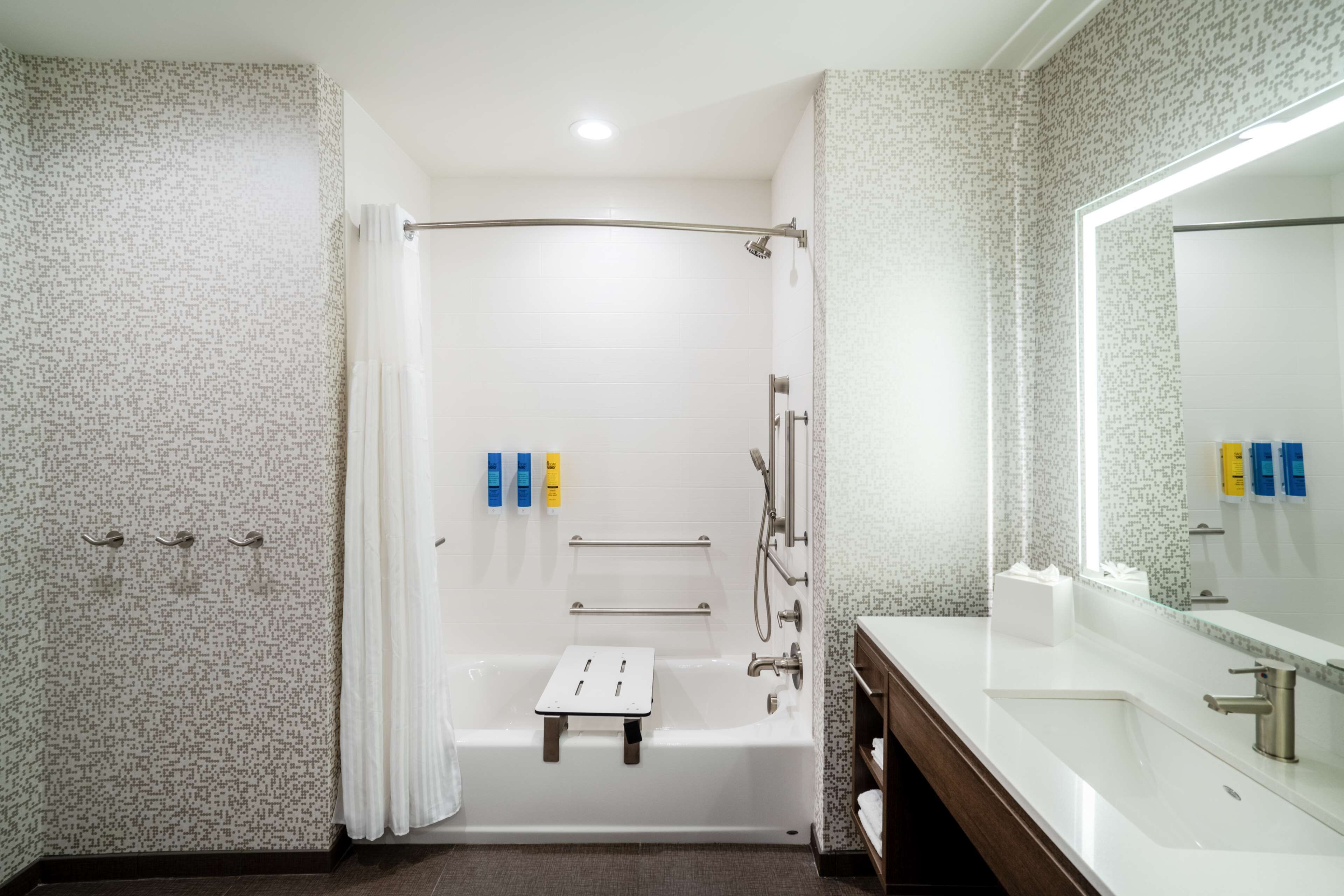 designer toiletries, hair dryer, towels