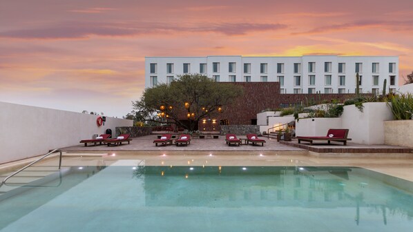 Outdoor pool, open 8:00 AM to 8:00 PM, pool umbrellas, pool loungers