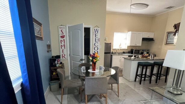 A modern kitchen with white cabinets, a built-in oven, and a microwave. - 🌹Southern’s Beauty 1🌹 (Kenner)