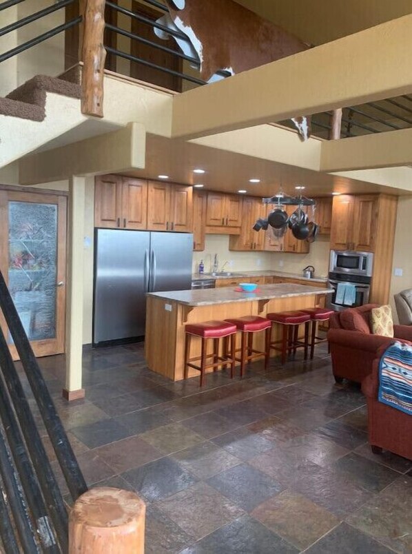 Enjoy cooking in this well-equipped kitchen with a central island and ample seating for four.