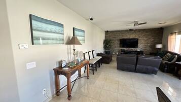 Smart TV, fireplace, foosball, books