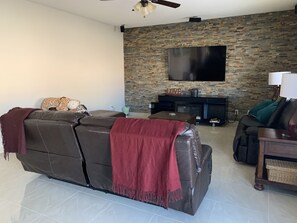 Smart TV, fireplace, table football, books