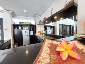 Fridge, microwave, stovetop, coffee/tea maker