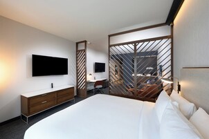 Desk, laptop workspace, blackout drapes, iron/ironing board