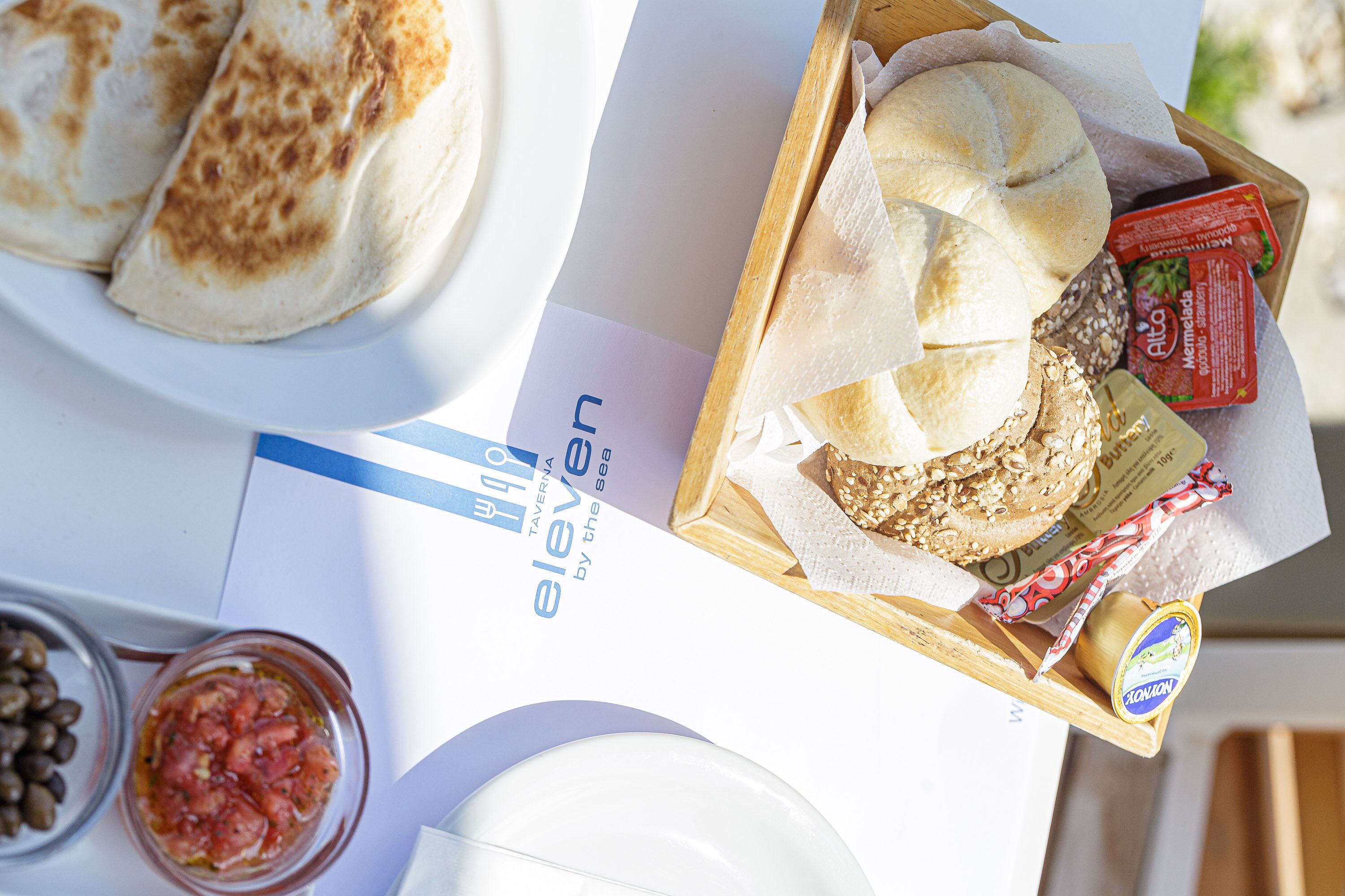 A tray with food items including bread, cheese, and condiments.