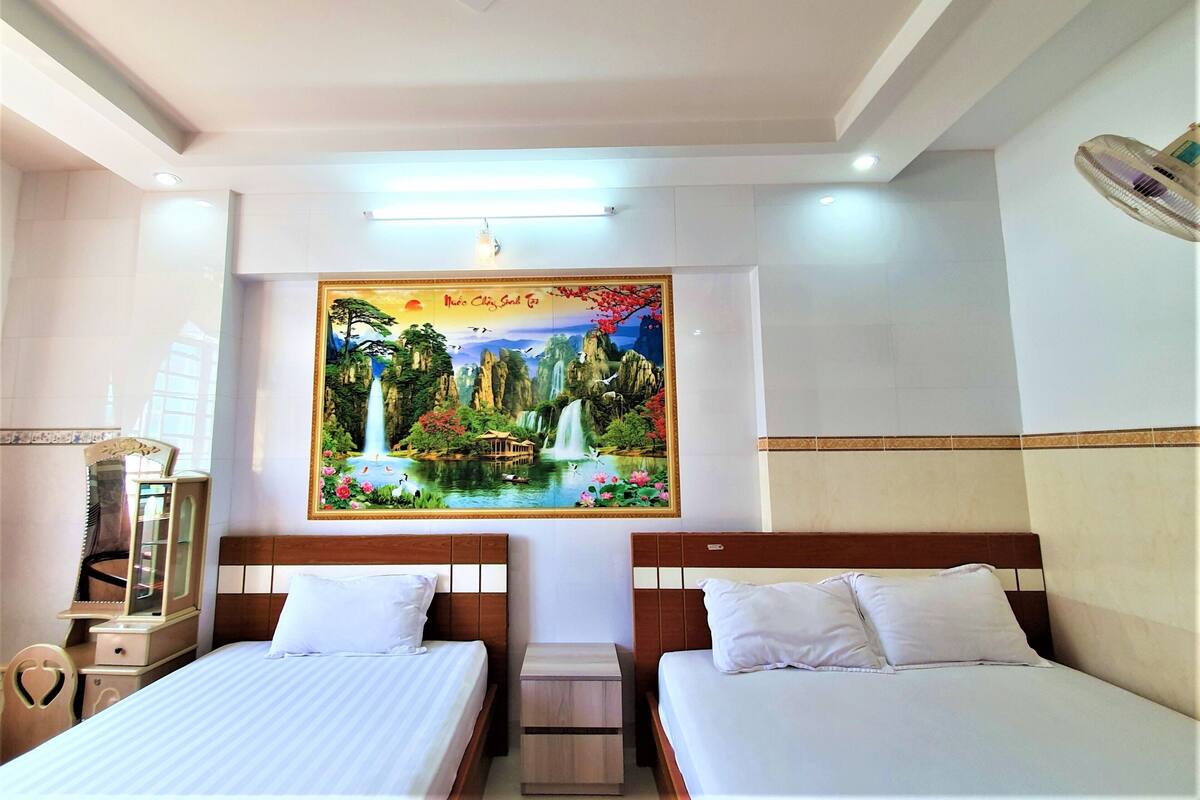 Deluxe Triple Room | Desk, iron/ironing board, free WiFi, bed sheets