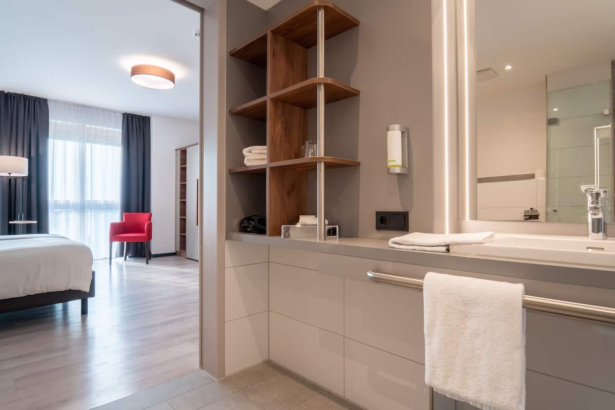 comfort plus double room | bathroom | shower, rainfall showerhead, hair dryer, towels