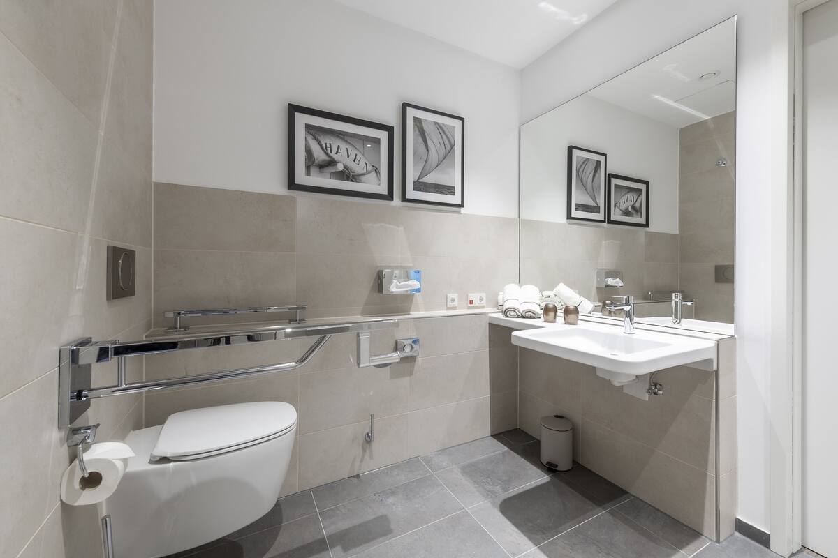 comfort twin room | bathroom | shower, hair dryer, soap, toilet paper