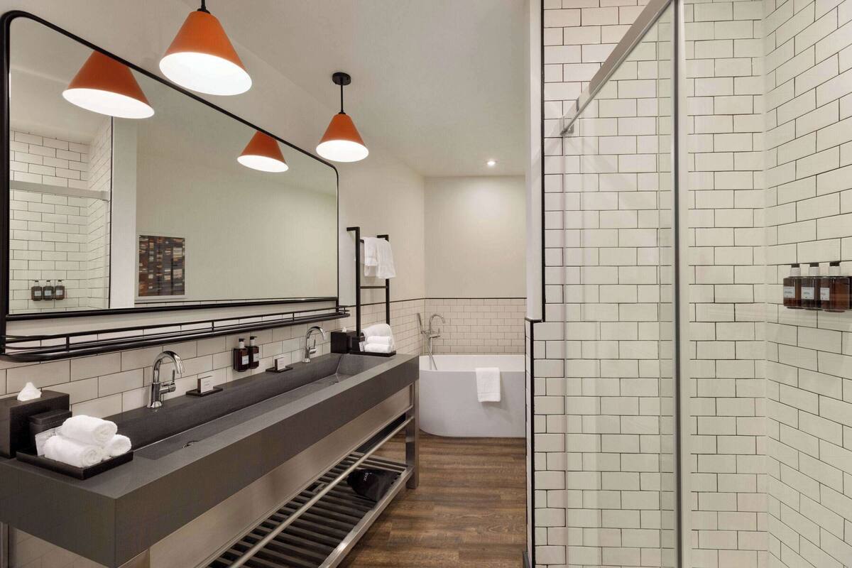 designer toiletries, hair dryer, towels, soap