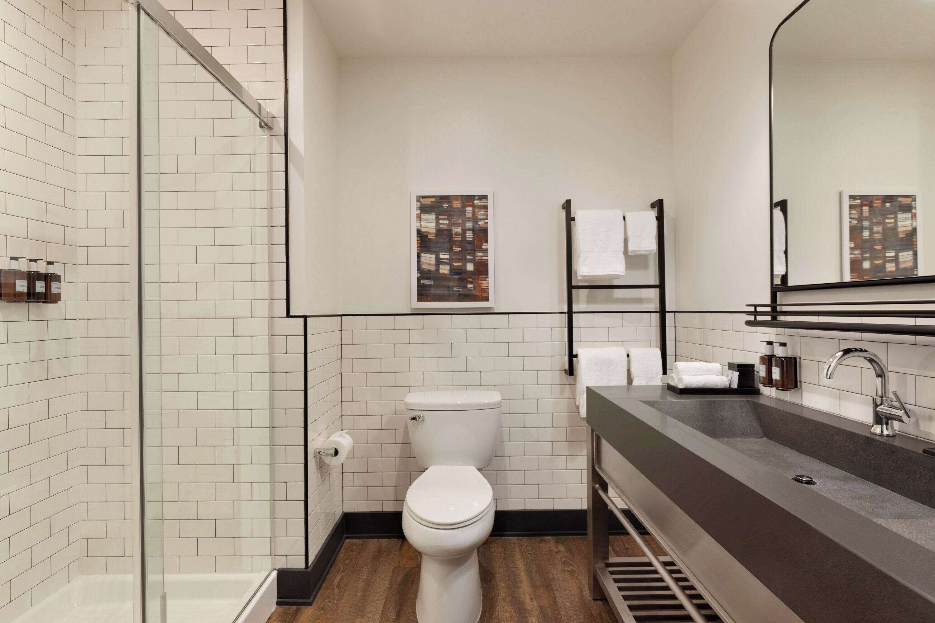 designer toiletries, hair dryer, towels, soap