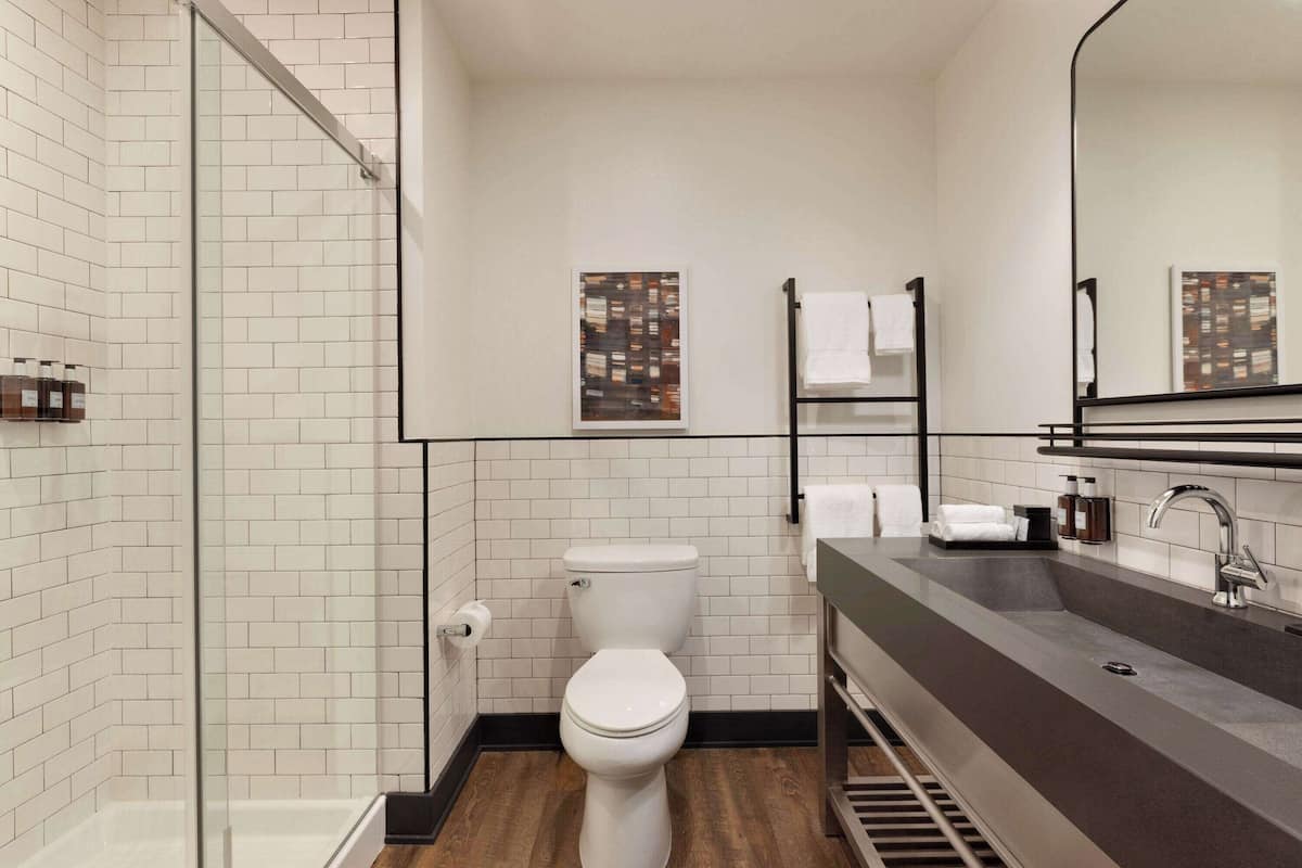 designer toiletries, hair dryer, towels, soap