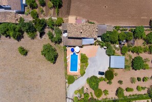An aerial view of a residential property with a swimming pool, a covered patio, and a fenced yard. - Nice villa with pool close to Pollença. Can Tomeu. (Pollensa / Pollença)
