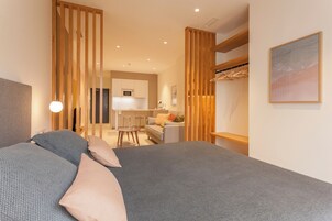 Premium bedding, down duvets, laptop workspace, soundproofing