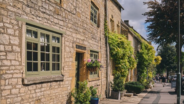 A stone building with a sign reading "The Old Mill." - Coniston House (Cheltenham)