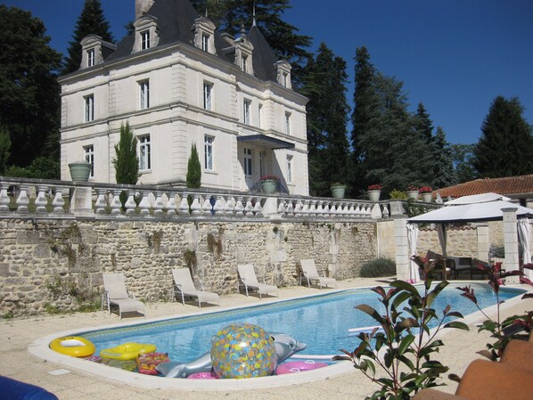 Outdoor pool, a heated pool, sun loungers