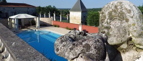Outdoor pool, a heated pool, pool loungers