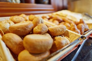 A tray of assorted baked goods, including bread rolls and croissants. - Tropical Islands Resort (Krausnick-Gross Wasserburg)