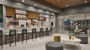 A modern bar area with seating and a counter. - Hyatt House Atlanta / Perimeter Center (Atlanta)