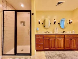 Combined shower/tub, hair dryer, towels, soap