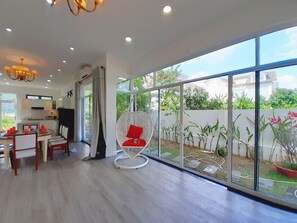Louis & Annie Villa | Living area | 40-inch flat-screen TV with cable channels, TV - Cala South Beach Villas (Nha Trang)