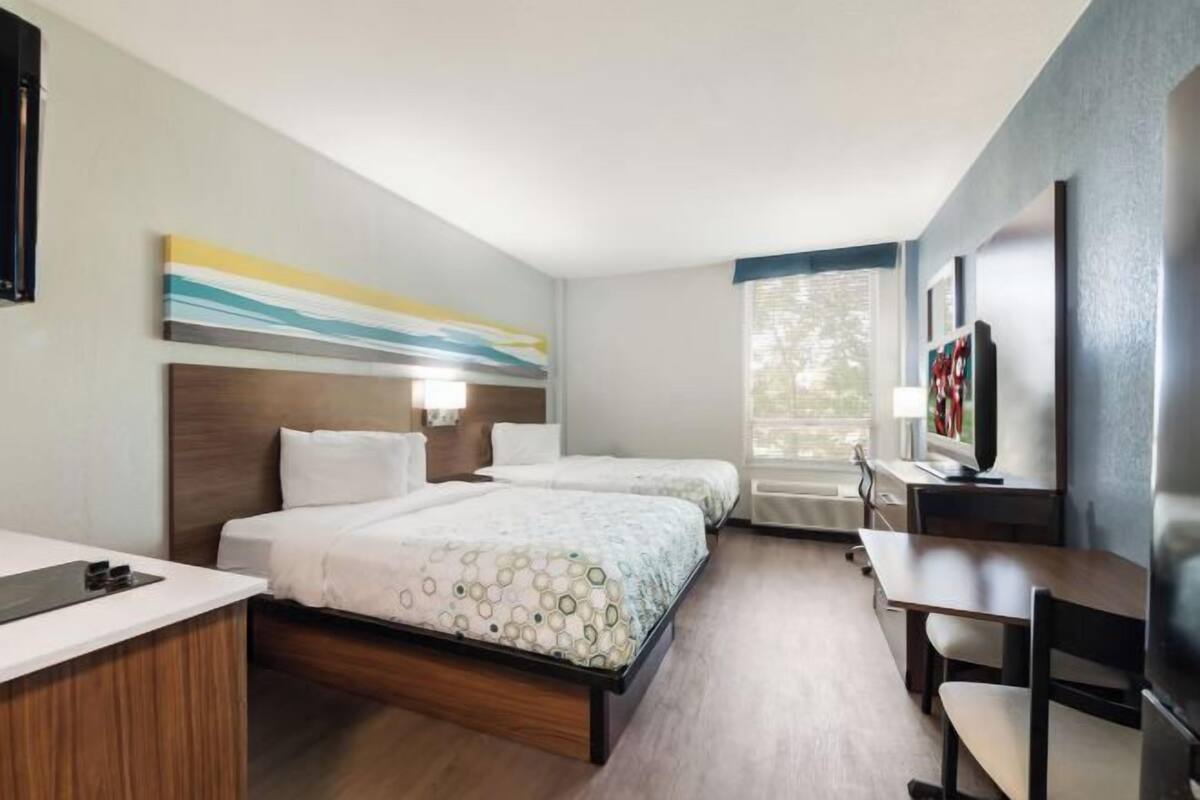 Desk, laptop workspace, blackout curtains, free WiFi
