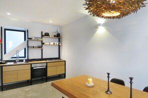 Enjoy meals in the kitchen with a dining table and integrated dishwasher.