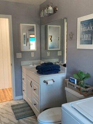 Combined shower/tub, hair dryer, towels, soap