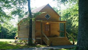 A small wooden cabin with a porch, surrounded by trees. - Masons Chapel at Springfield 1842 (Halifax)
