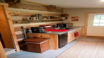 Fridge, microwave, coffee/tea maker, cookware/dishes/utensils