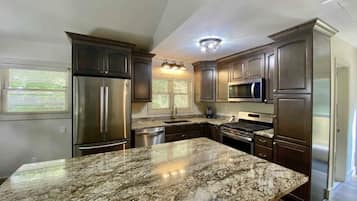 Coffee/tea maker, fridge, microwave, oven
