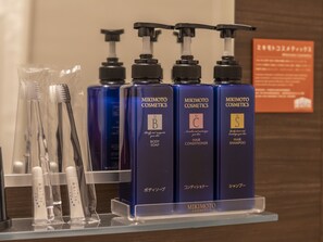 A display of MIKIMOTO cosmetics products including body soap, hair conditioner, and shampoo. - HALE Kyoto Toji (Kyoto)