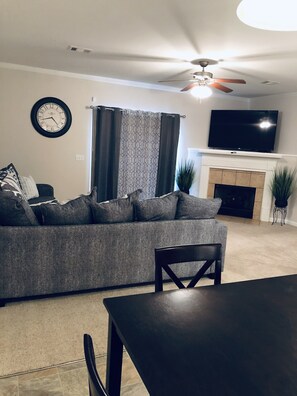 Smart TV, fireplace, books, offices