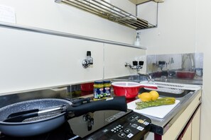 Fridge, microwave, stovetop, cookware/dishes/utensils
