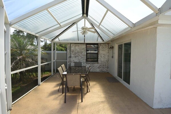 Outdoor dining - Stunning Fenced Home | Pool (Heated Opt) & Hot Tub (Palm Coast)