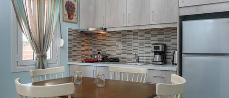 Fridge, microwave, stovetop, coffee/tea maker