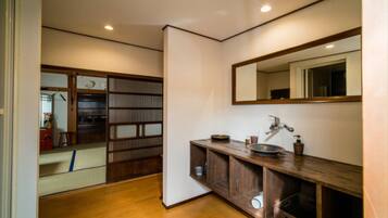 Combined shower/tub, free toiletries, hair dryer, slippers
