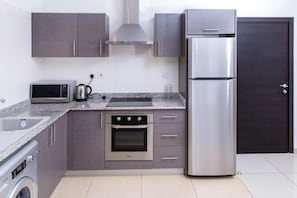 Apartment, 2 Bedrooms | Private kitchen | Fridge, microwave, oven, stovetop - PLS Apartments-East Legon (Accra)
