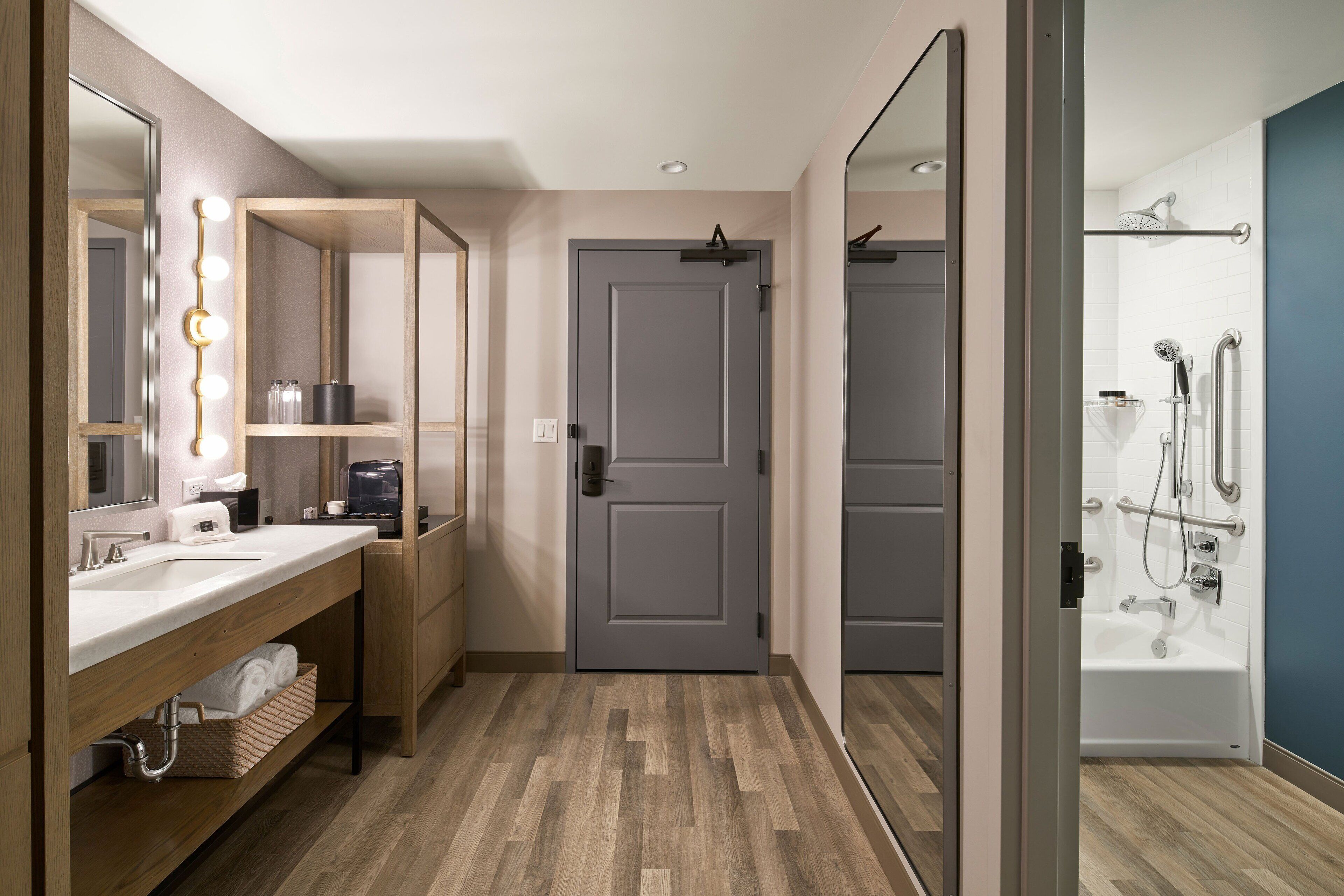 standard room, 2 queen beds | bathroom | shower, rainfall showerhead, hair dryer, towels