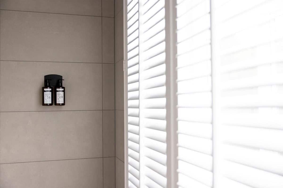 classic double room | bathroom | shower, rainfall showerhead, eco-friendly toiletries, towels