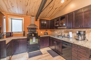 Oven, coffee/tea maker, cookware/dishes/utensils - Renovated Historic Suite - Air Conditioning - Heart of Downtown Ouray (Ouray)